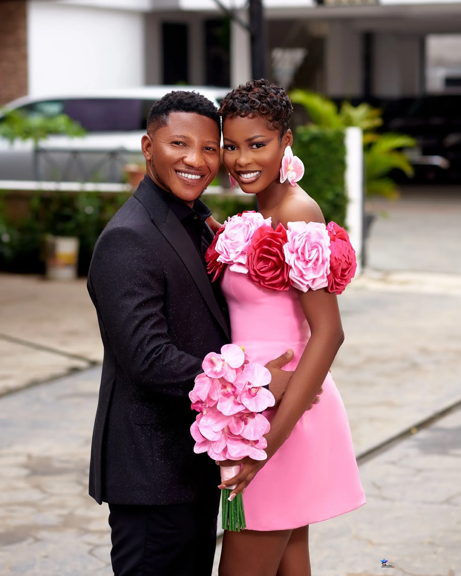 The couple in pink and black at their pre-wedding shoot