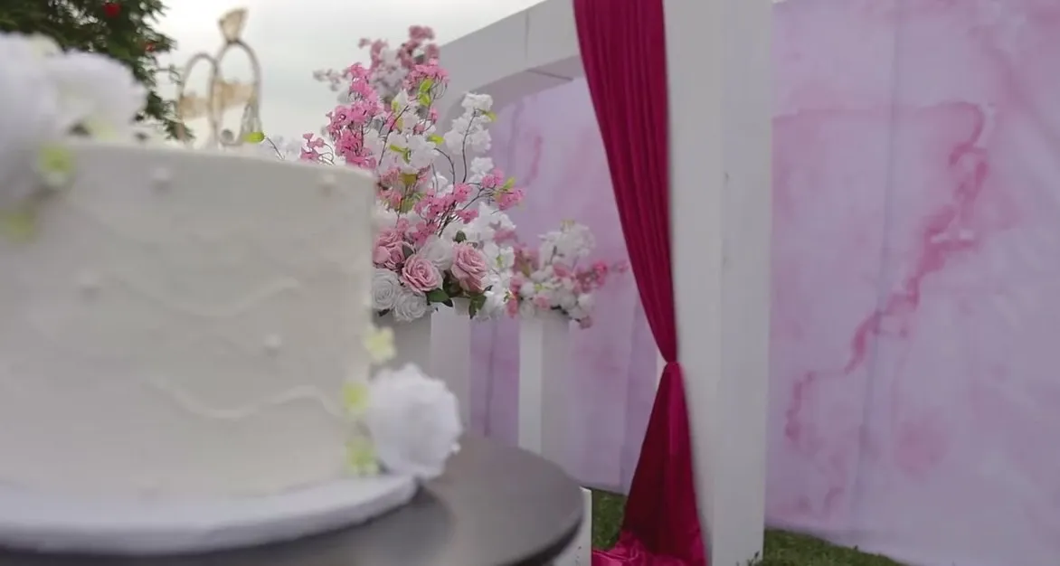 White wedding cake with a Mr & Mrs topper