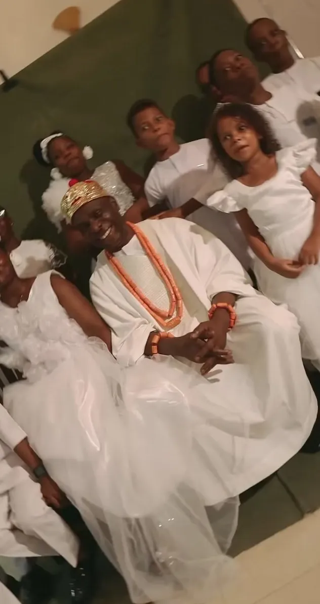 The royal family in white gathered around HRM