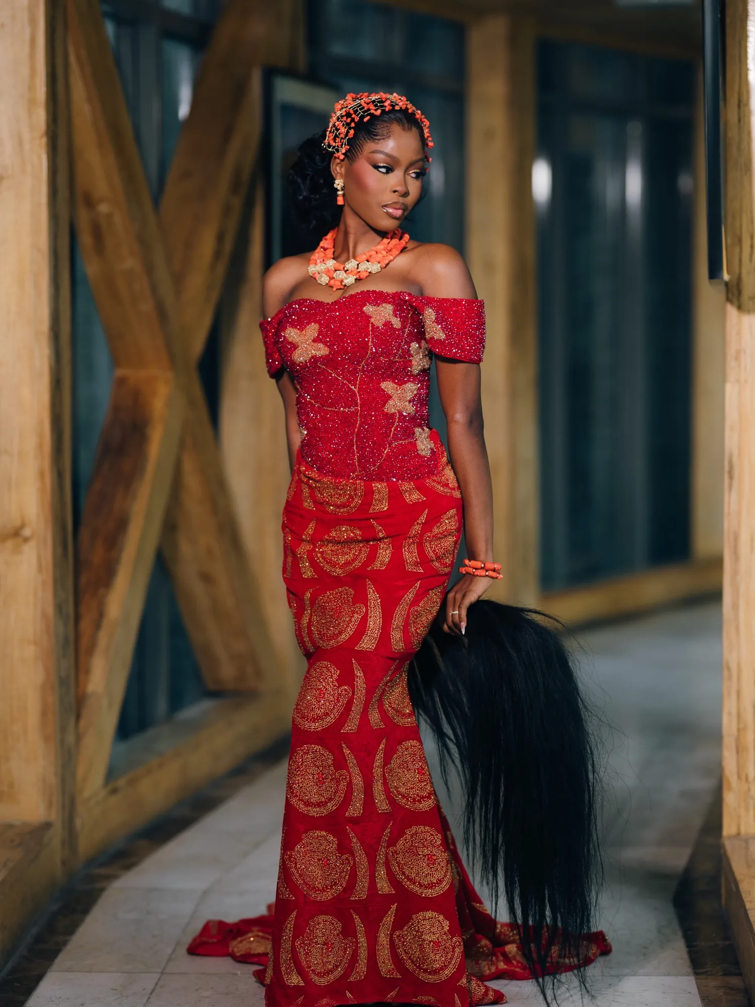 Bride in red lace with a horsetail whisk