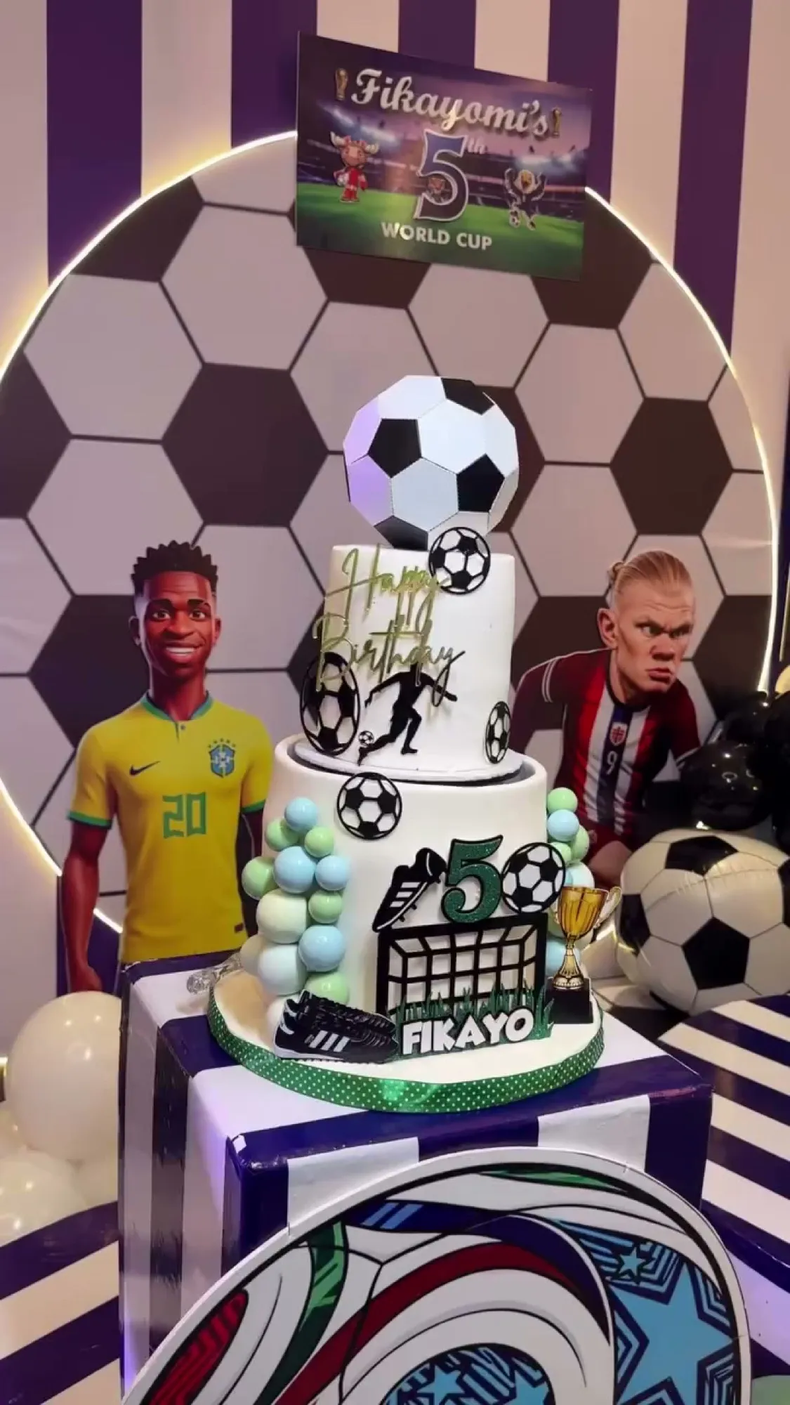 A five-year-old's World Cup: a pitch-green floor, a balloon tunnel, jerseys for everyone and a trophy cake.